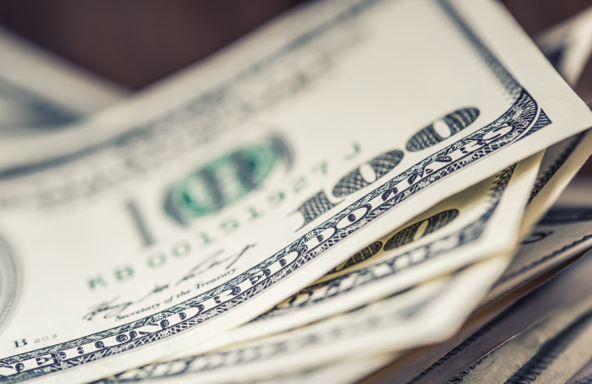 A stack of hundred dollar bills