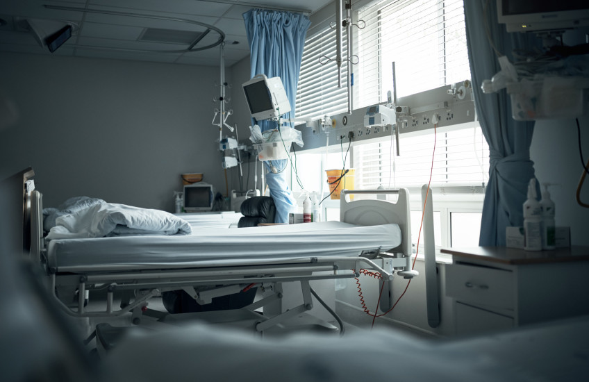 An empty hospital bed.