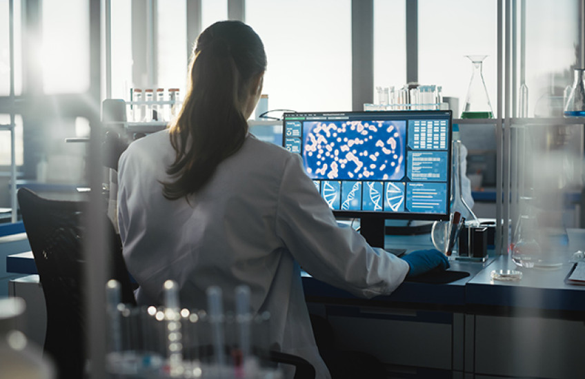 researcher in front of a computer screen