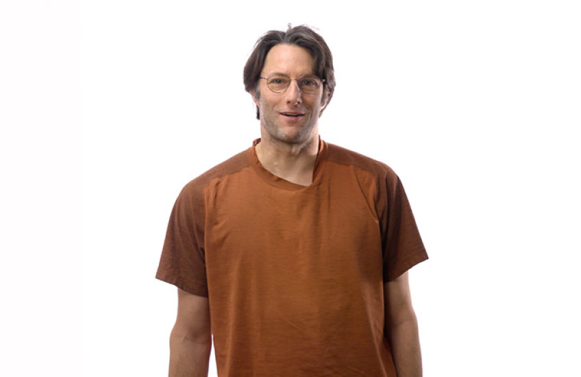 Michael Springer standing in front of a white background