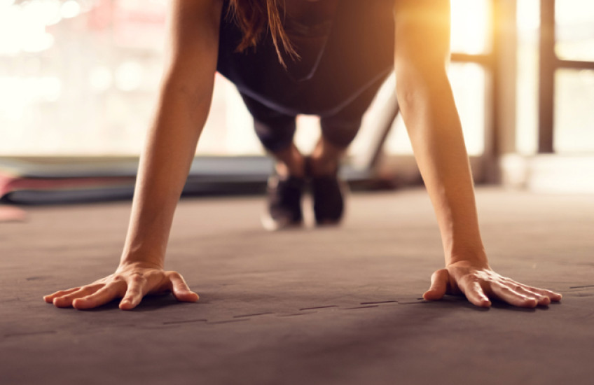 An athlete holding a plank position.