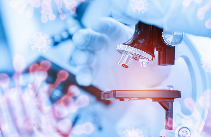 digital collage of coronavirus, microscope, and gloved hand