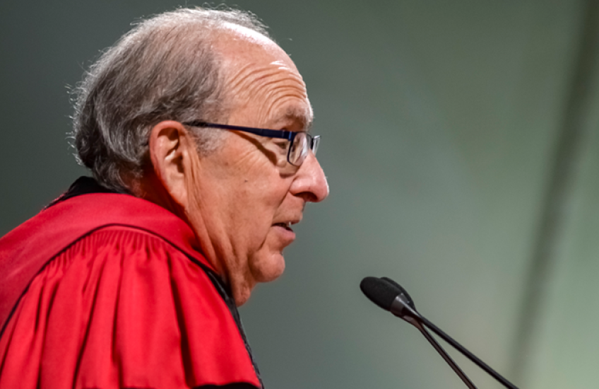 Dean Donoff for Harvard School of Dental Medicine in front of microphone