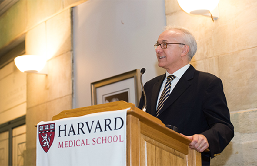 George Q. Daley speaks to an audience. 