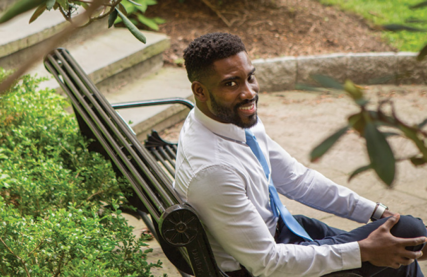 Photo of Nwanaji-Enwerem on a bench in a park