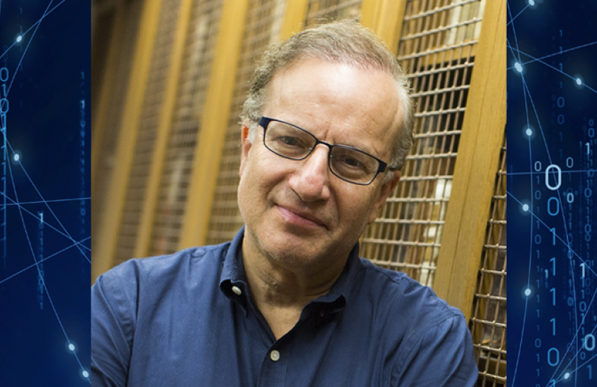 Photo of Isaac Kohane over a blue background