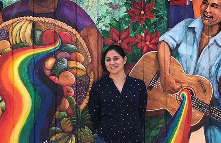 photo of morales temich with mural