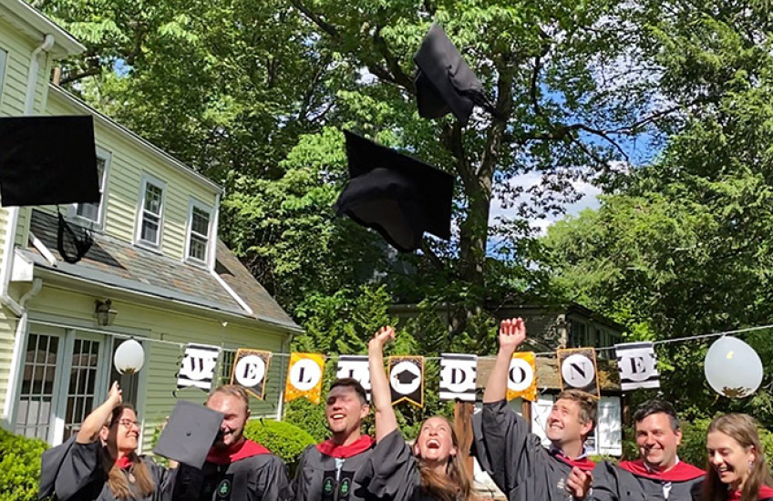 Grads tossing mortarboards