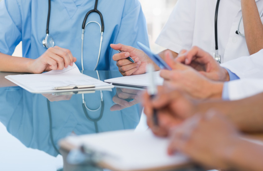 Generic photo of health care workers holding clipboards 