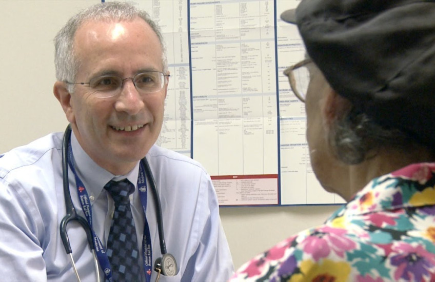 A doctor talks to a patient