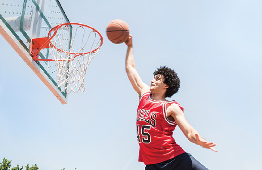 Amen dunking a basketball