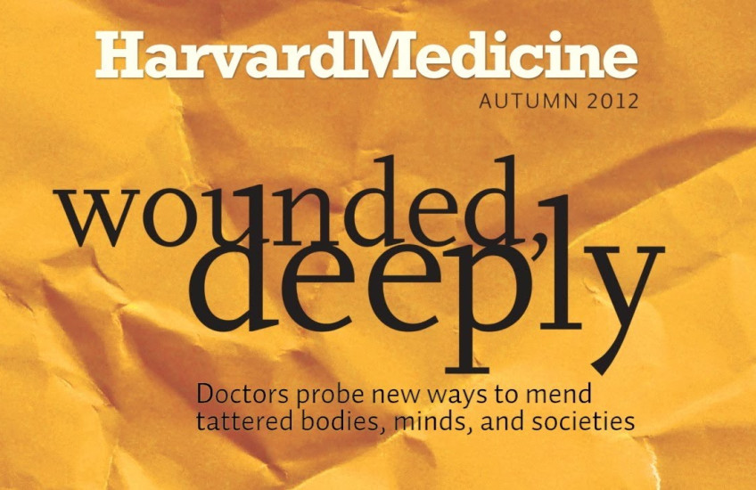 Crumpled yellow paper with "Wounded, Deeply" over it 