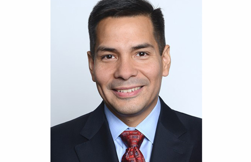 head shot of a man in a suit