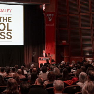 George Q. Daley addresses a seated crowd during his 2026 State of the School address