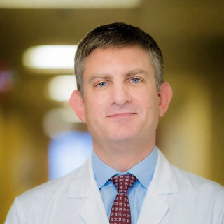 Alt text: Portrait photo of Brian Wolpin in a white coat.