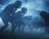 Football players in silhouette on the playing field