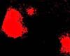 Irregular red patches representing dopamine on a black background that is the brain