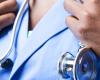 Image of a Black physician, just hands, scrubs and a stethoscope