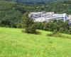 Photo of hospital building in a rural setting in the mountains
