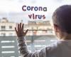 Child silhouetted against hospital window with letter-shaped magnets spelling out Corona virus