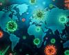 Colorful illustration of coronaviruses superimposed over a world map