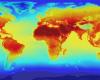A false color map of the world with red, yellow and orange indicating temperature change due to greenhouse gas emissions.