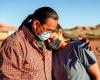 A husband and wife comfort one another during the Coronavirus shutdown on the Navajo nation in Arizona