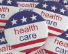 Multiple political buttons with U.S. flag and health care printed on them