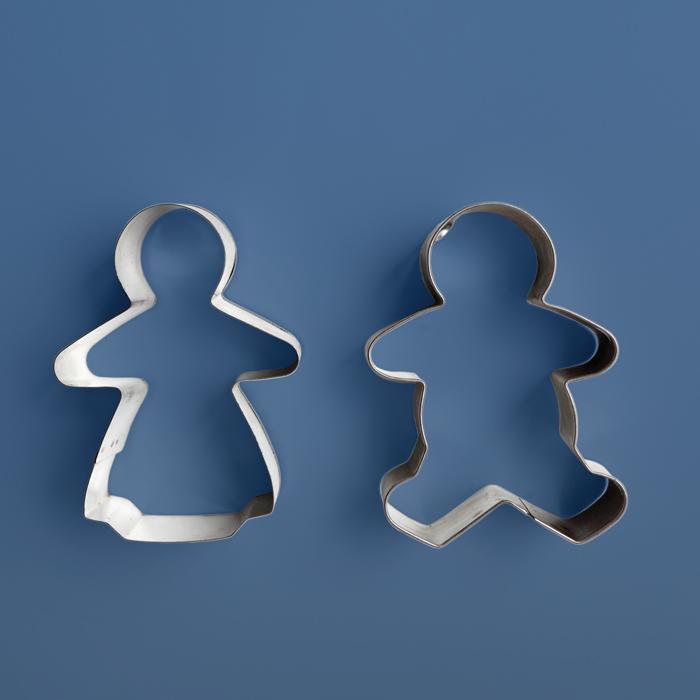 gingerbread cookie cutters in the form of a man and a woman