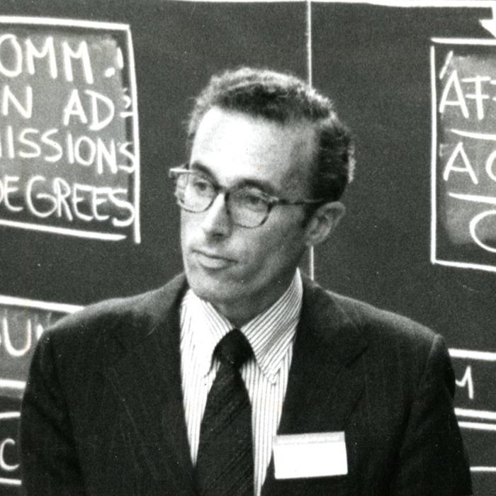 Howard Hiatt in front of a blackboard at the Harvard School of Public Health, circa 1970s