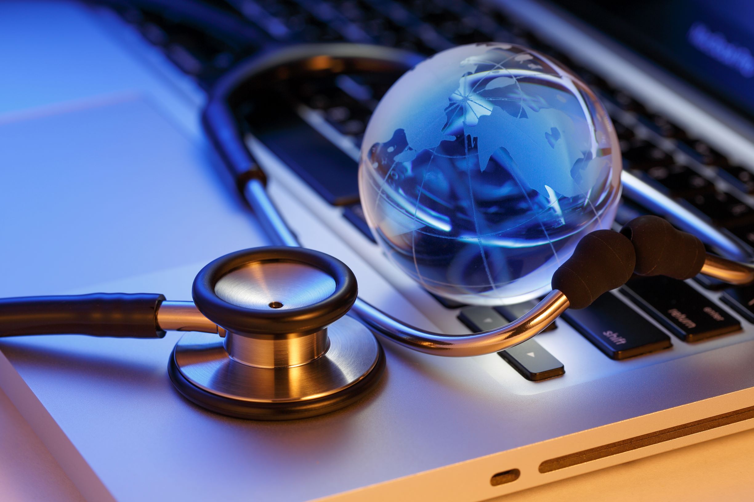 laptop, stethoscope, globe