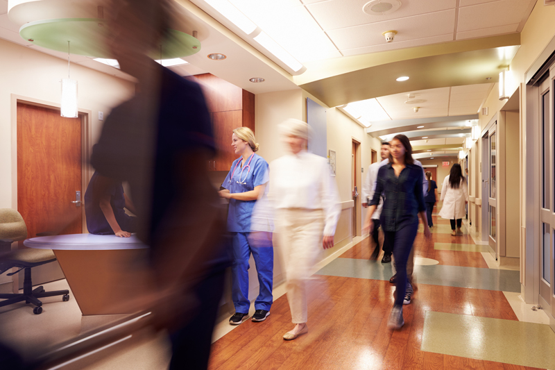 blurred stock image of busy hospital corridor