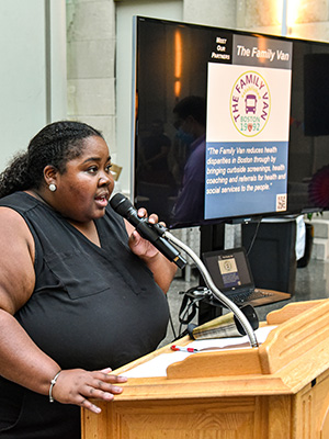 Kayla Lambright speaking to students from a podium