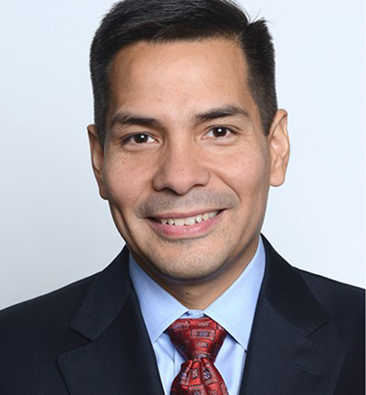 head shot of a man in a suit