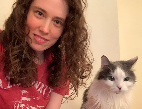selfie of woman next to tabby cat
