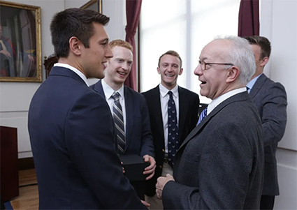 Logan Briggs, Mike Seward, Derek Soled with HMS Dean George Q. Daley at the 2019 Dean’s Community Service Awards 