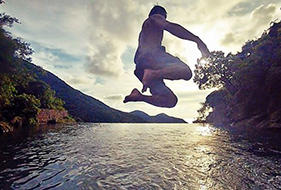 Chan jumping into the Tai O Infinity Pool while traveling in Hong Kong. Image: Will Chan