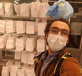 Avilash Cramer in front of respirators sterilized at Dana-Farber